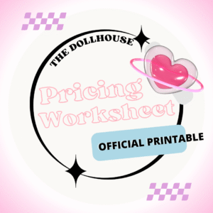 The Dollhouse "Pricing Worksheet" official printable graphic. Pink and white design with a glossy 3D heart and ring, bold black circular border, sparkling star accents, and purple checkerboard details. Text reads: "THE DOLLHOUSE Pricing Worksheet OFFICIAL PRINTABLE." Branding for a downloadable worksheet to help content creators and sex workers calculate rates, set prices, and manage earnings.